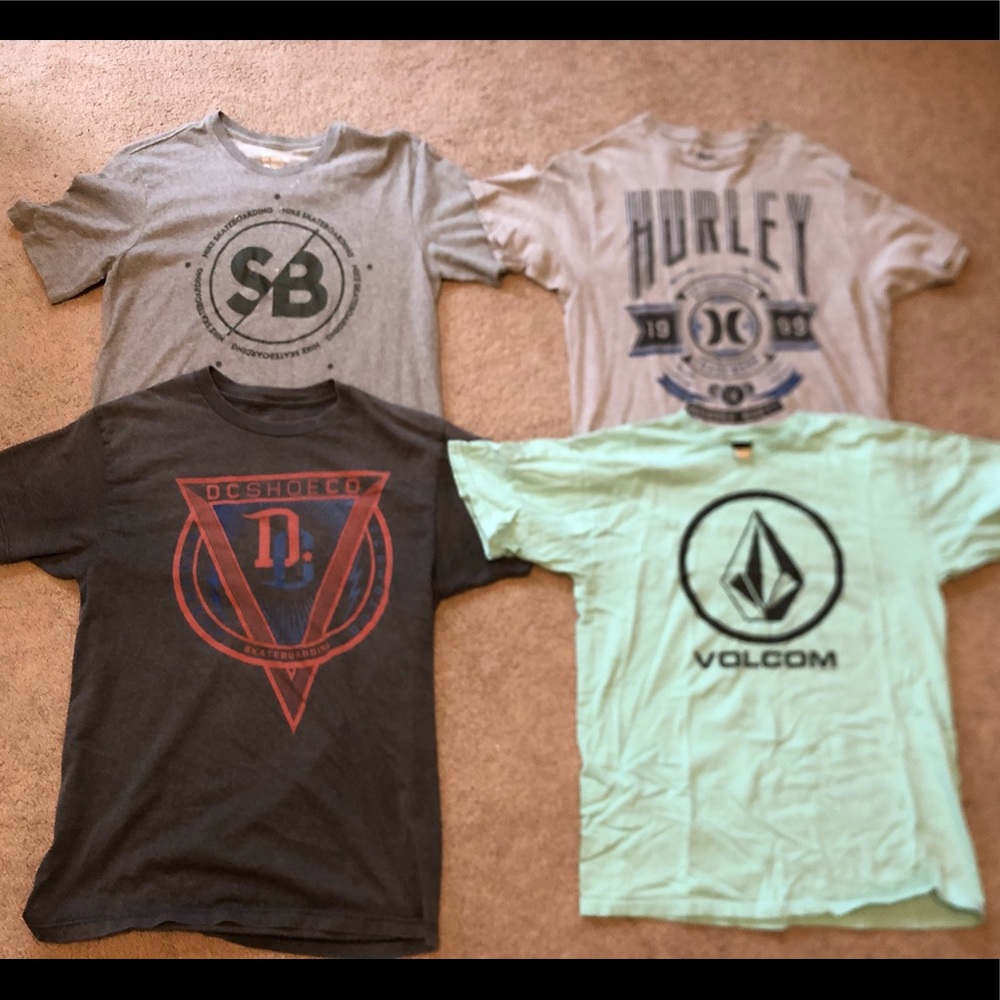 4 Mens medium sized skateboarding shirts.